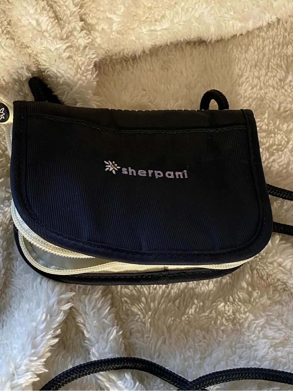 Sherpani zippered pouch for ID, cash, keys.  Perfect for travel